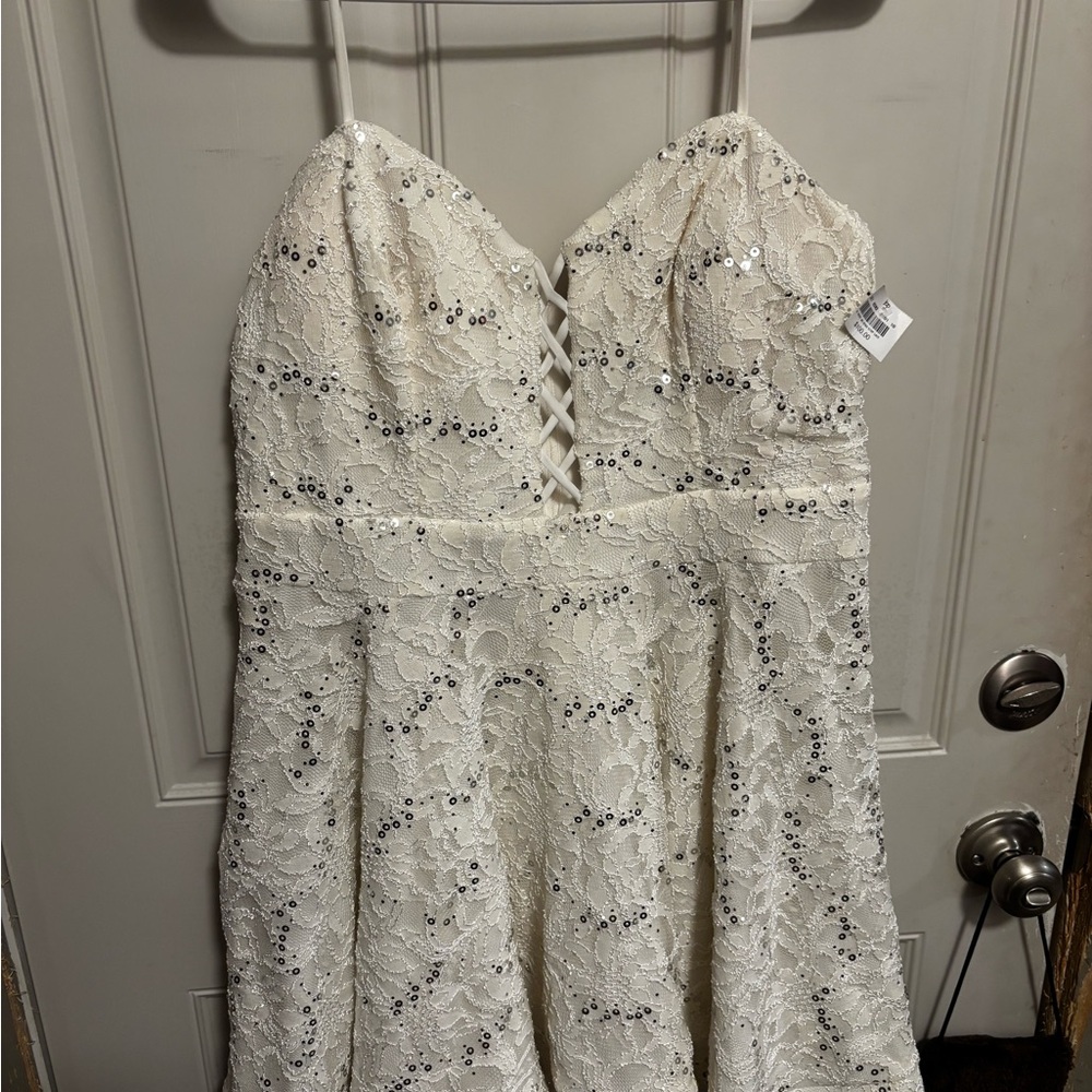 B. Smart White Lace Dress with Silver Accents